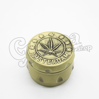 Grinder metal 50 mm with 4 part silver-gold leaf pattern